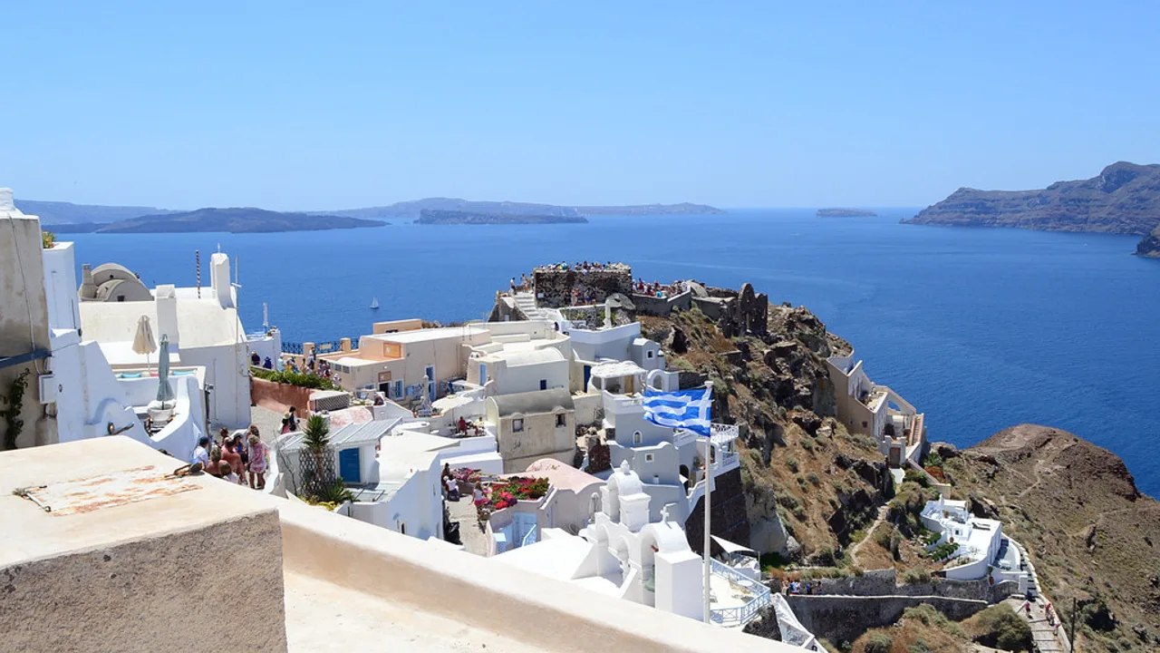The clifftop village of Oia and the Santorini caldera, seen from the Byzantine Castle sunset viewpoint