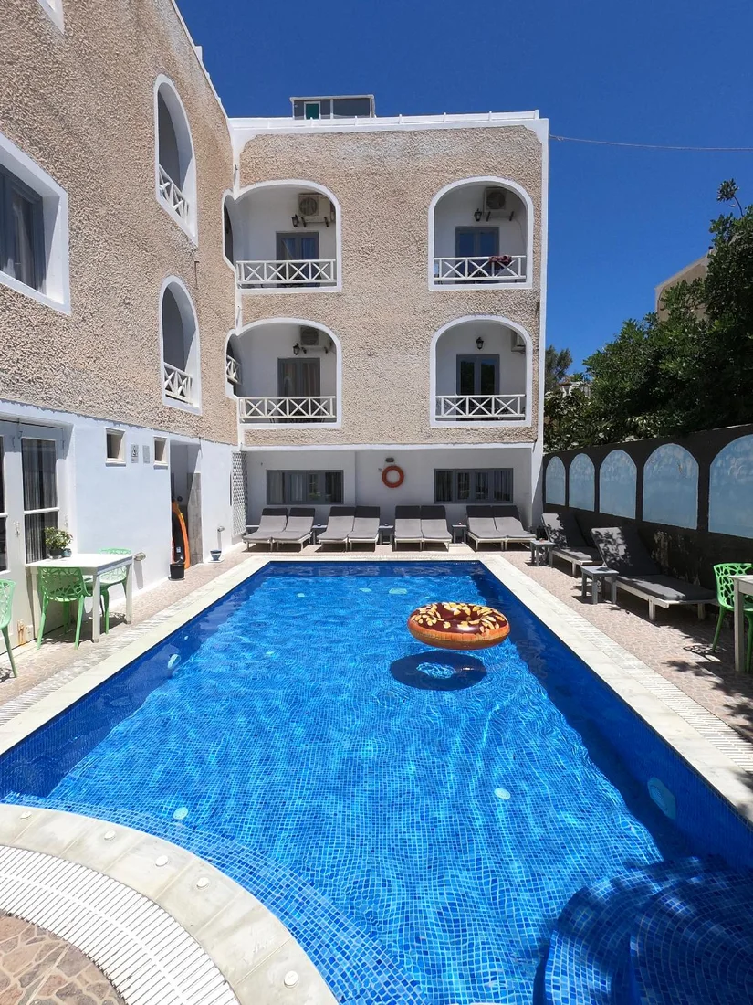 The pool and whitewashed studios of Anny Studios Perissa Beach, Santorini