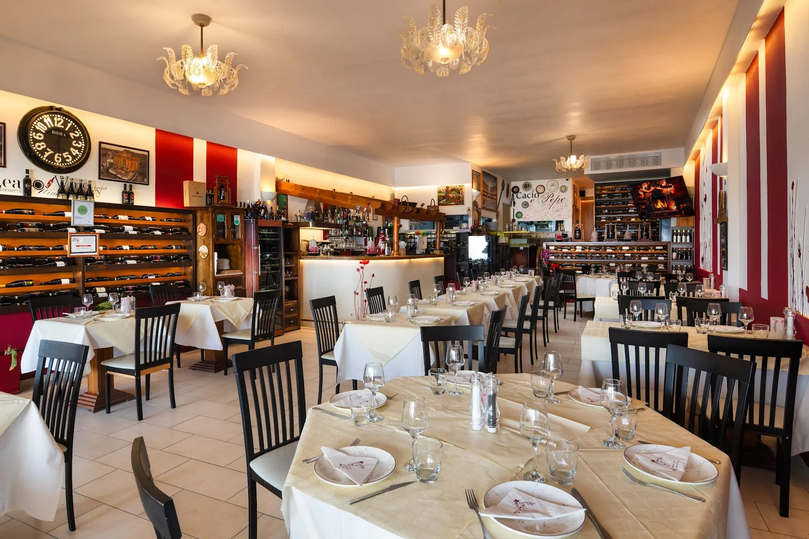 The wine-lined dining room of Cacio e Pepe Italian restaurant in Fira, Santorini