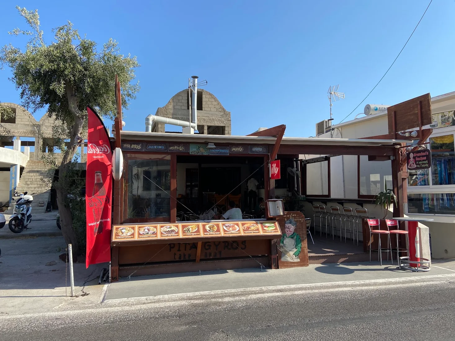 The Grandma's Recipes gyros takeaway kiosk on the beach road in Perissa, Santorini