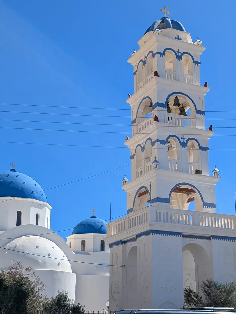 The whitewashed lanes and low buildings of the beach village of Perissa on Santorini