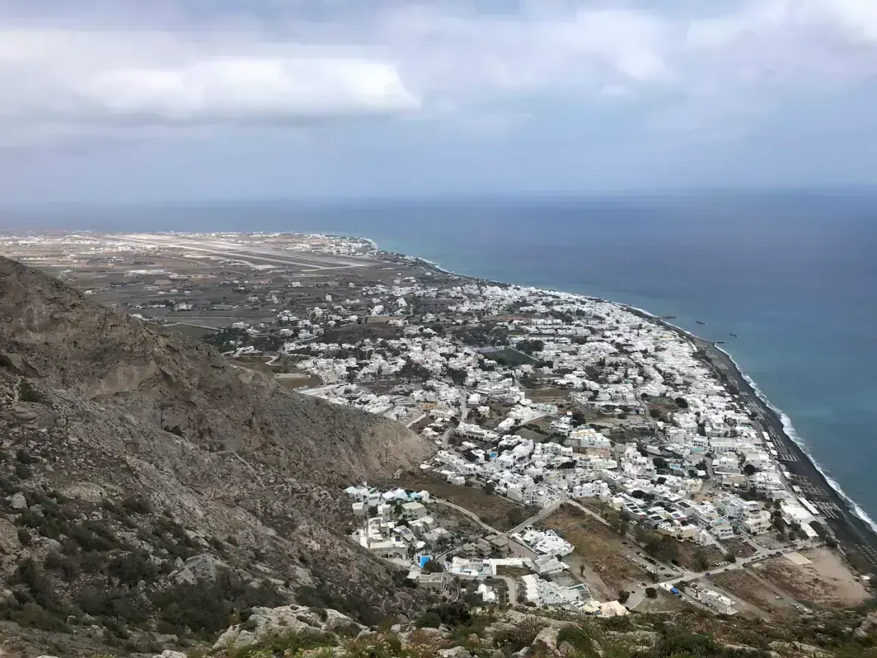 The black-sand coast and village of Perissa on Santorini from above