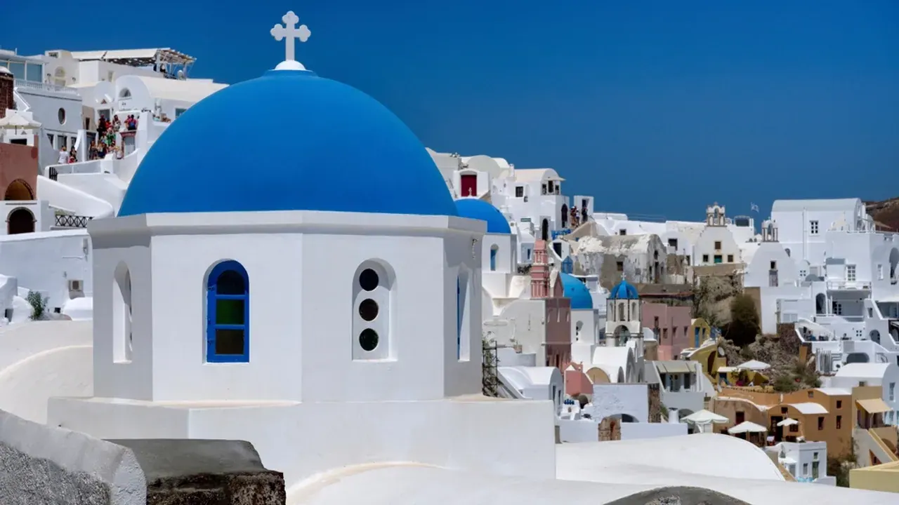 The blue-domed church and white cascading houses of Oia, Santorini