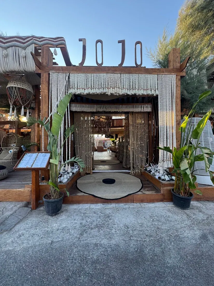 The macramé entrance of JoJo beach bar at Perivolos, Santorini