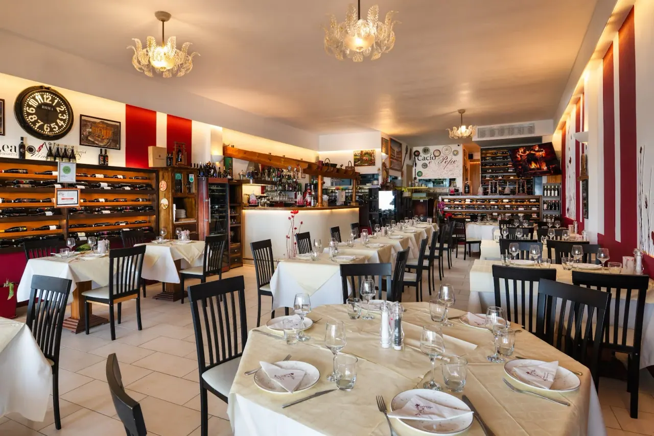 The wine-lined dining room of Cacio e Pepe Italian restaurant in Fira, Santorini