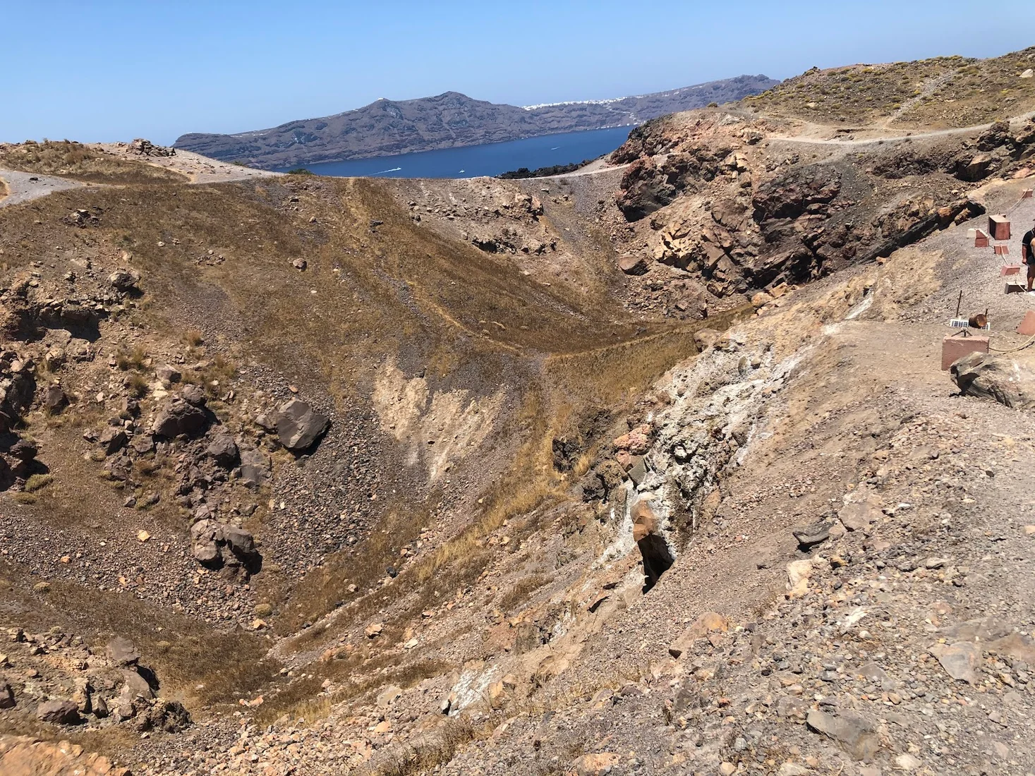 The volcanic crater of Nea Kameni above the Santorini caldera, seen on a boat cruise