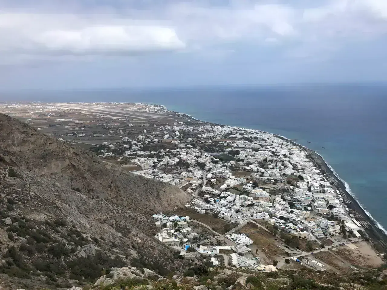 The black-sand coast and village of Perissa on Santorini from above
