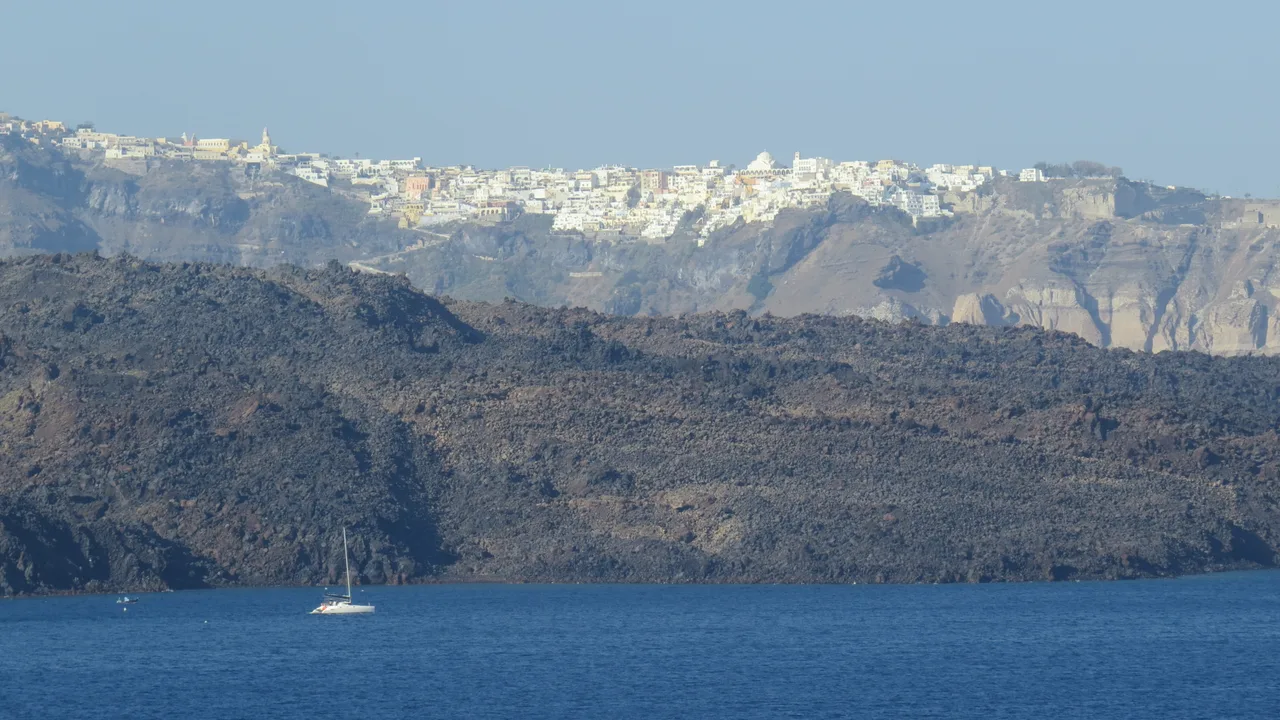 The whitewashed houses of Fira spilling down the caldera cliff on Santorini