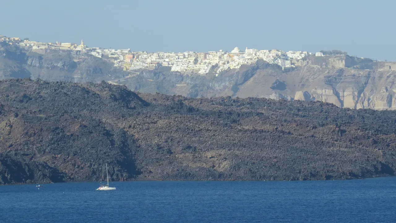 The whitewashed houses of Fira spilling down the caldera cliff on Santorini